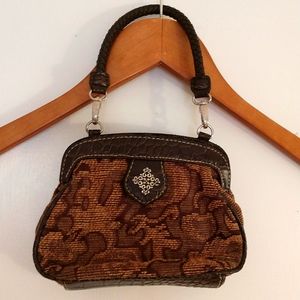 Small Carpetbag Clutch with Braided Handle and Magnetic Closure.